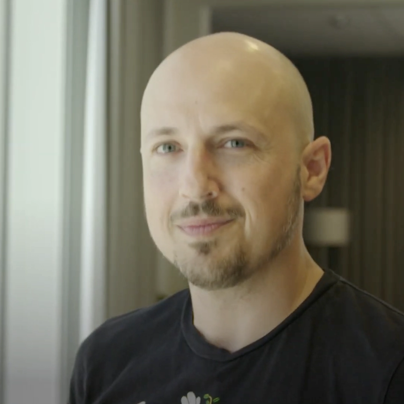 Close-up of a man’s face, representing ‘Think big, then build it.’